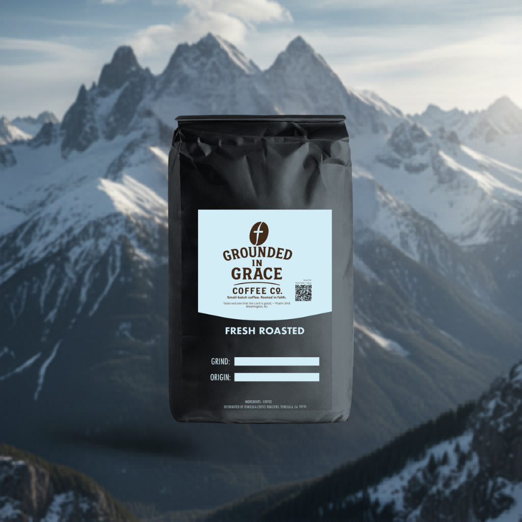 Coffee package with 'Grounded in Grace Coffee Co.' label against a mountainous background