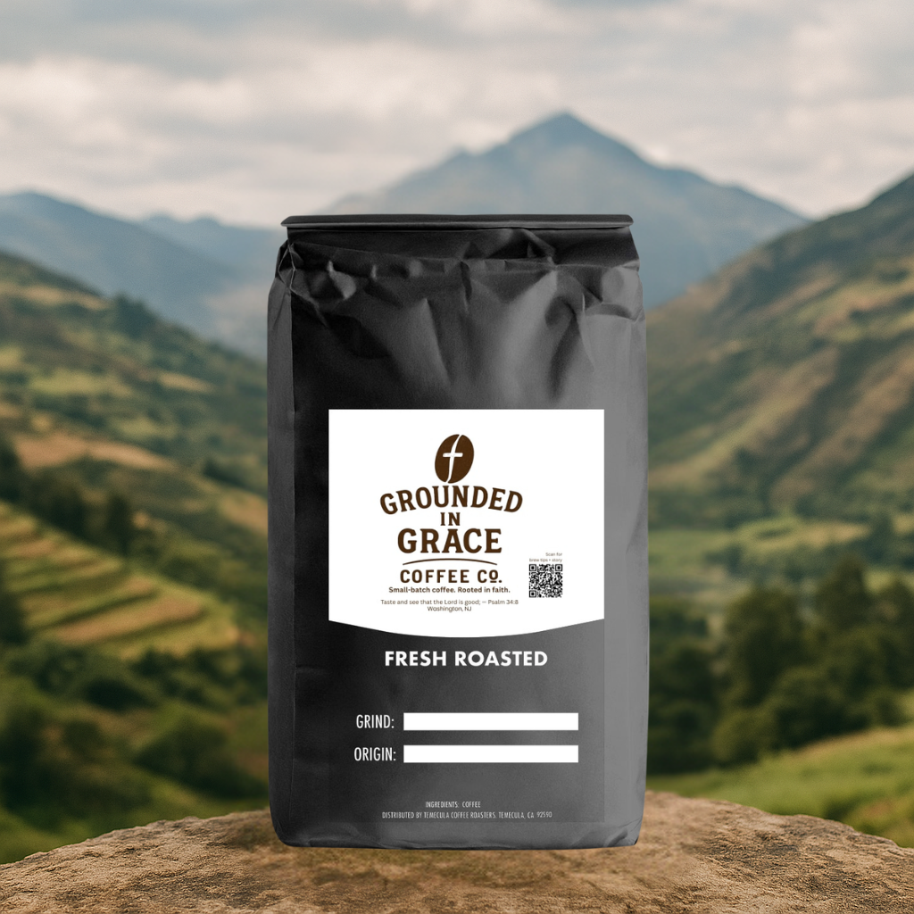 Grounded in Grace Coffee Co. bag with mountainous landscape in the background