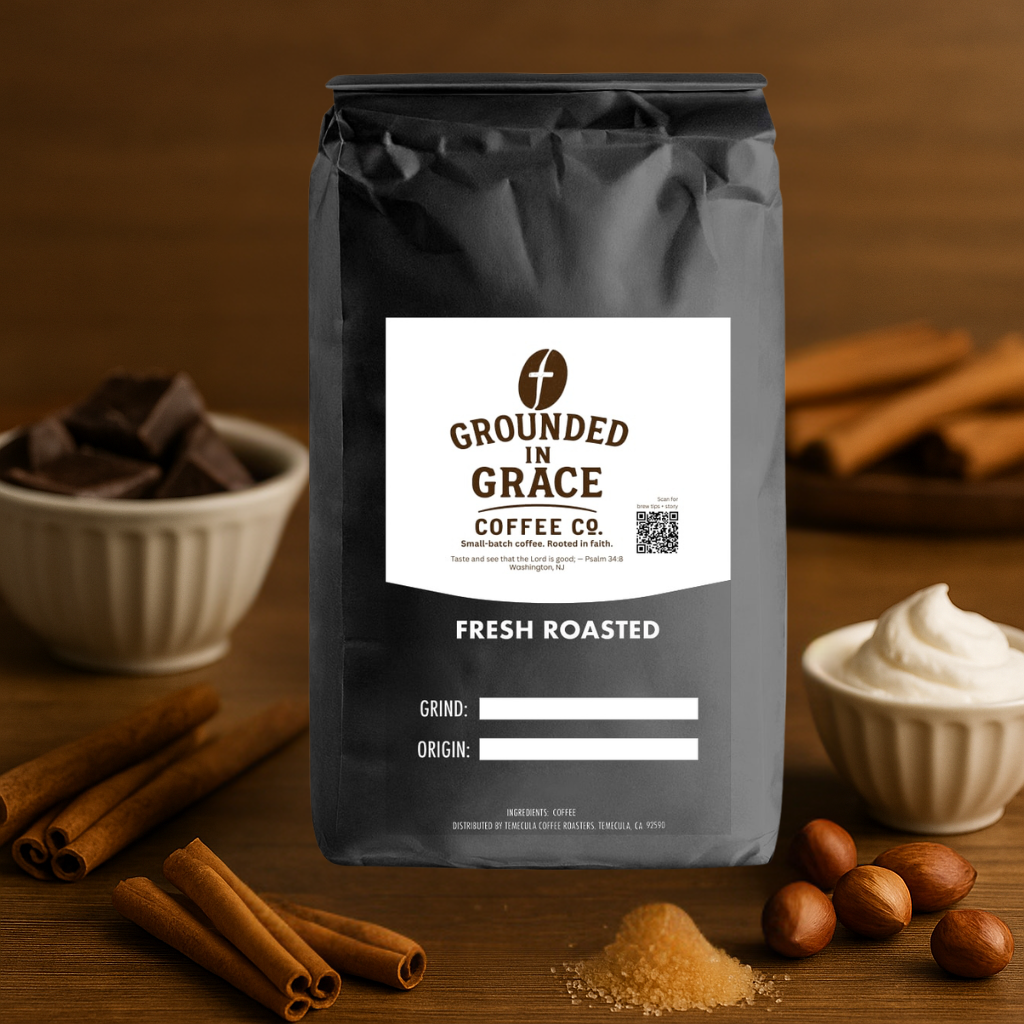 Grounded in Grace Coffee Co. sampler bag on a wooden surface with cinnamon sticks and other ingredients.
